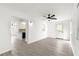 Bright living room with a view of kitchen, new floors and fresh white walls at 11643 Sw 137Th Loop, Dunnellon, FL 34432