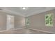 Inviting bedroom with tray ceilings, luxury vinyl flooring, and an ensuite bathroom at 1251 Cresswind Blvd, Deland, FL 32724