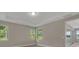 Well-lit bedroom with tray ceilings and lots of natural light, offering a serene retreat at 1251 Cresswind Blvd, Deland, FL 32724