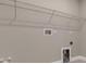 Picture of a closet with a shelf along the wall and hookups for a washer and dryer below at 1251 Cresswind Blvd, Deland, FL 32724
