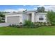 Charming home with a gray garage door, a gray brick paver walkway, and a well-maintained, landscaped lawn at 1251 Cresswind Blvd, Deland, FL 32724