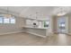 Open concept living featuring a kitchen with quartz counters and a large island that is great for entertaining guests at 1251 Cresswind Blvd, Deland, FL 32724