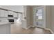 Bright kitchen featuring white cabinets, subway tile backsplash, and stainless steel appliances at 1251 Cresswind Blvd, Deland, FL 32724
