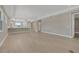A spacious living room with hardwood flooring and views of the kitchen at 1251 Cresswind Blvd, Deland, FL 32724