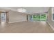 Open-concept living room with sliding glass doors and hardwood floors at 1251 Cresswind Blvd, Deland, FL 32724