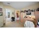 Bedroom featuring neutral carpet, light walls, a workspace, and entry to the rest of the home at 136 Majestic Forest Run, Sanford, FL 32771