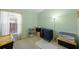 Bedroom with storage bins and suitcases, as well as a large window that brings in natural light at 136 Majestic Forest Run, Sanford, FL 32771