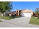Inviting single Gathering home boasts a well-maintained lawn and a two-car garage at 136 Majestic Forest Run, Sanford, FL 32771