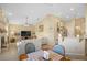 Living room and kitchen with tile floors, ceiling fan, fireplace, and lots of light at 136 Majestic Forest Run, Sanford, FL 32771