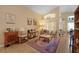 Cozy living room with stylish furnishings, a decorative rug, and ample natural light at 136 Majestic Forest Run, Sanford, FL 32771