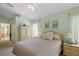 Comfortable main bedroom with large windows and ceiling fan at 136 Majestic Forest Run, Sanford, FL 32771