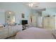 Spacious main bedroom with pastel walls, ceiling fan, ensuite bathroom and walk-in closet at 136 Majestic Forest Run, Sanford, FL 32771