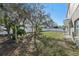View of the backyard with a lawn and a white fence at 1368 Falconwood Ct, Apopka, FL 32712