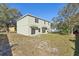 Large backyard view of the home featuring a spacious lawn at 1368 Falconwood Ct, Apopka, FL 32712