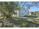 Side view of the home showing the expansive lawn at 1368 Falconwood Ct, Apopka, FL 32712