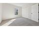 Well-lit bedroom with neutral carpet, a closet, and a window bringing in natural light at 1368 Falconwood Ct, Apopka, FL 32712