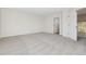 Bright bedroom featuring plush carpeting, neutral walls, and an ensuite bathroom at 1368 Falconwood Ct, Apopka, FL 32712