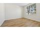 Bright, airy bedroom features new laminate flooring and a large window at 1368 Falconwood Ct, Apopka, FL 32712