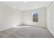 Bright bedroom features neutral carpet, a closet, and a large window providing ample natural light at 1368 Falconwood Ct, Apopka, FL 32712