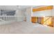 Bonus room with a stairwell and carpeting, built-in cabinets and countertop, and window letting in plenty of natural light at 1368 Falconwood Ct, Apopka, FL 32712