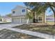 Charming two-story home featuring a two-car garage and a well-maintained front yard at 1368 Falconwood Ct, Apopka, FL 32712
