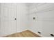 Small Laundry room features wire shelving, a white door, and vinyl flooring at 1368 Falconwood Ct, Apopka, FL 32712
