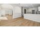 Open floor plan with hardwood floors and open view into kitchen area at 1368 Falconwood Ct, Apopka, FL 32712