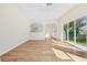 Bright living room with hardwood floors, arched doorways, and natural light at 1368 Falconwood Ct, Apopka, FL 32712