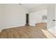 Spacious living room featuring open doorways and wood-look floors at 1368 Falconwood Ct, Apopka, FL 32712