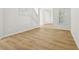Bright living room with light wood floors, white walls, and stairway access at 1368 Falconwood Ct, Apopka, FL 32712