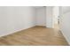 Spacious living room area featuring laminate flooring with an arched doorway at 1368 Falconwood Ct, Apopka, FL 32712