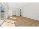 Bright living room with light wood floors and sliding glass doors to the yard at 1368 Falconwood Ct, Apopka, FL 32712