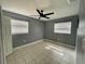 Comfortable bedroom with tiled flooring and a ceiling fan, creating a cozy and inviting space at 1416 Braebury Dr, Leesburg, FL 34748