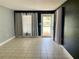 Bright and airy living room with tile floors and natural light at 1416 Braebury Dr, Leesburg, FL 34748
