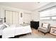 Inviting bedroom featuring a comfortable bed, accent chair, and plenty of closet space at 1611 Chestnut Ave, Winter Park, FL 32789