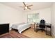 Simple bedroom with a single bed, desk, and window, offering a cozy and functional space at 1611 Chestnut Ave, Winter Park, FL 32789