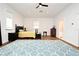 Bedroom with a ceiling fan, large windows, and wood-look floors at 1611 Chestnut Ave, Winter Park, FL 32789