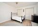 Inviting bedroom featuring a comfortable bed, accent chair, and plenty of closet space at 1611 Chestnut Ave, Winter Park, FL 32789