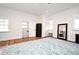 Large bedroom with a modern feel featuring wood floors, multiple windows and dark furniture at 1611 Chestnut Ave, Winter Park, FL 32789