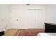 Minimalist bedroom with a closet, showcasing clean lines and functional furniture at 1611 Chestnut Ave, Winter Park, FL 32789