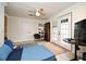 Bedroom featuring a ceiling fan, hardwood floors, and an exterior door leading to the outside at 1611 Chestnut Ave, Winter Park, FL 32789