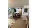 Dining room with farmhouse table, barn door, hardwood floors, and designer wallpaper and paint at 1611 Chestnut Ave, Winter Park, FL 32789