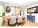 Cozy dining room featuring a wooden table, velvet chairs, and stylish wallpaper at 1611 Chestnut Ave, Winter Park, FL 32789
