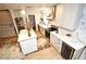 A well-lit kitchen features white cabinetry, stainless steel appliances, and a wine cooler at 1611 Chestnut Ave, Winter Park, FL 32789
