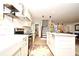 Bright kitchen with subway tile backsplash, open shelves, and stainless steel oven at 1611 Chestnut Ave, Winter Park, FL 32789