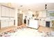 Bright kitchen with white cabinets, stainless steel appliances, and a colorful rug at 1611 Chestnut Ave, Winter Park, FL 32789