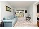 Comfortable living room with a blue sofa and sliding glass doors to the backyard at 1611 Chestnut Ave, Winter Park, FL 32789