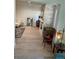 Living room showcasing wood floors and a stone fireplace, complemented by stylish furnishings and ample natural light at 1611 Chestnut Ave, Winter Park, FL 32789
