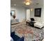 Comfortable living room with a white couch, vibrant area rug, and stylish decor at 1611 Chestnut Ave, Winter Park, FL 32789