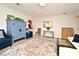 Cozy living room features blue furniture and a vibrant area rug over light-colored floors at 1611 Chestnut Ave, Winter Park, FL 32789